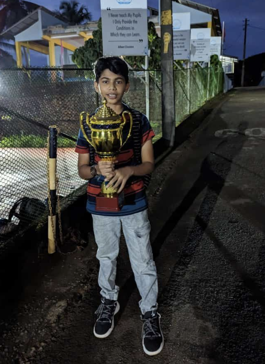 Riza Mohamed holding trophy award competition win Kerala India